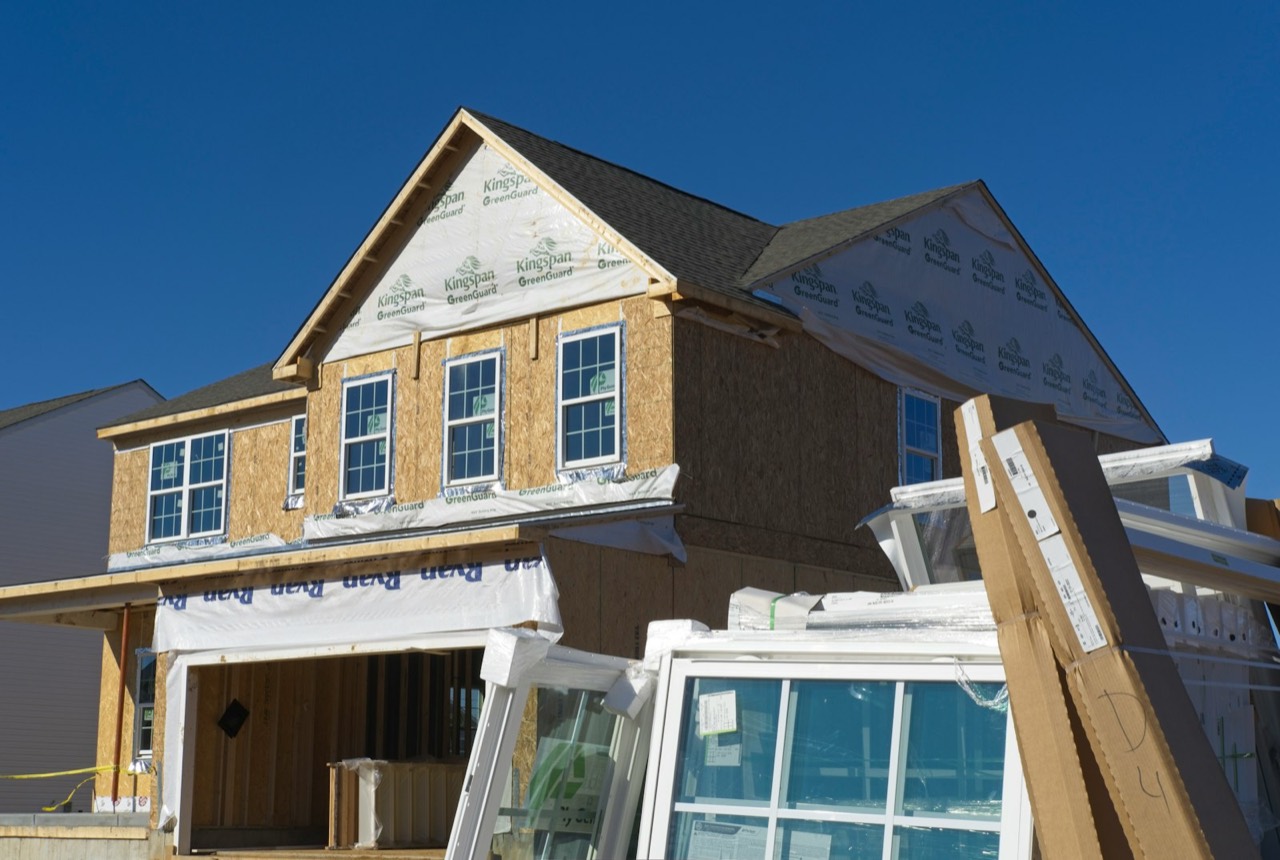 New two-story home sheathed and ready for windows
