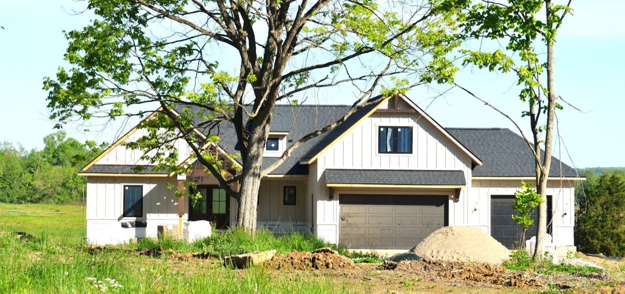 New single-family home under construction on an open lot